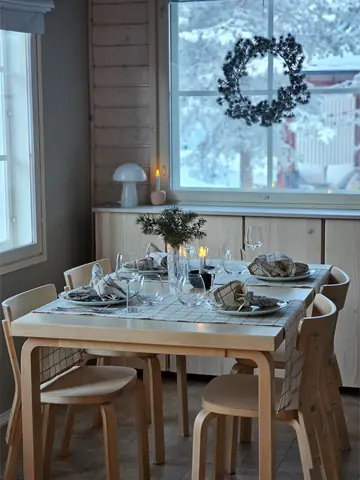 Dining table set for a family dinner at Chalet Nulkka