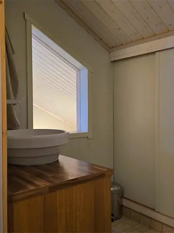 Upstairs toilet with washbasin