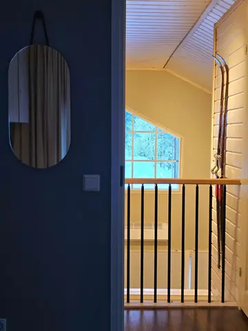View from the upstairs landing down to the living room
