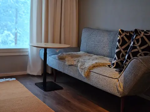 Partitioned upstairs workspace with a sofa bed, good for remote work